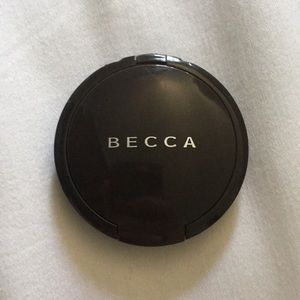 BECCA mini highlighter in the shade opal